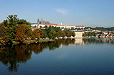 Reflection associated with autum trees within the Vltava lake